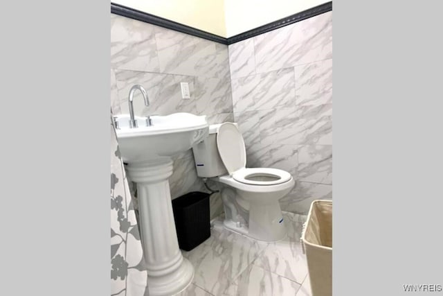 1008 Niagara Ave, Niagara Falls, NY 14305 - bathroom featuring tile walls and marble finish flooring
