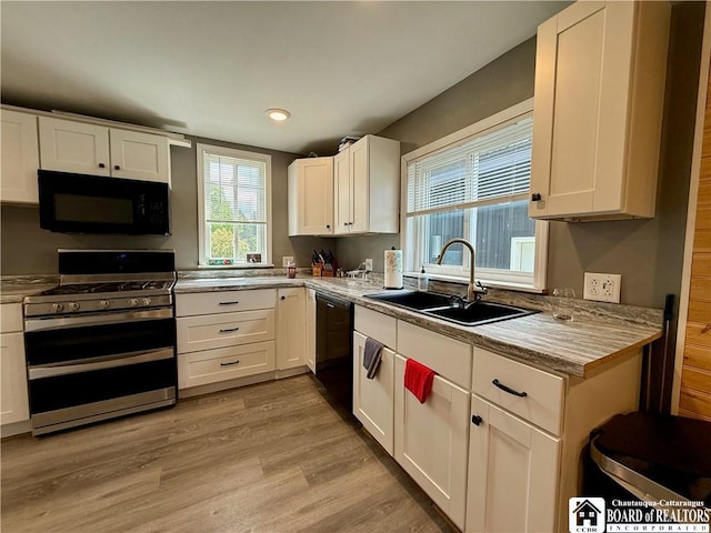 918 Crown St, Olean-City, NY 14760 - kitchen featuring black appliances, white cabinets, light countertops, and recessed lighting