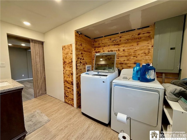 918 Crown St, Olean-City, NY 14760 - laundry area with independent washer and dryer, electric panel, light wood-style floors, wooden walls, and recessed lighting
