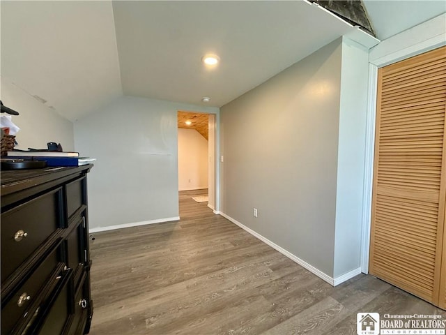 918 Crown St, Olean-City, NY 14760 - bedroom with wood finished floors, vaulted ceiling, and a closet