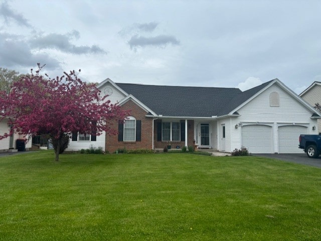 783 Whistlers Cove Ln, Greece, NY 14612 - view of front of property with an attached garage, a front yard, driveway, and brick siding