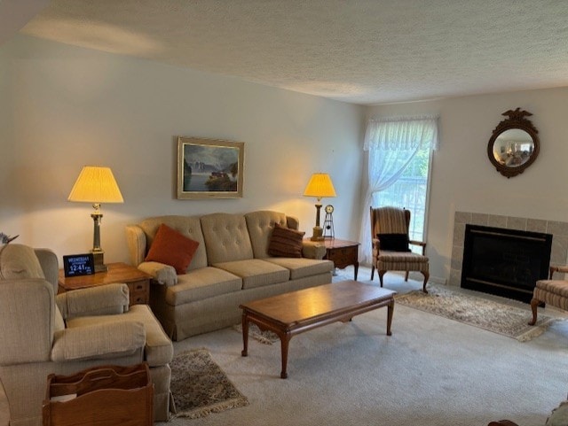 783 Whistlers Cove Ln, Greece, NY 14612 - living room featuring a textured ceiling, carpet floors, and a fireplace