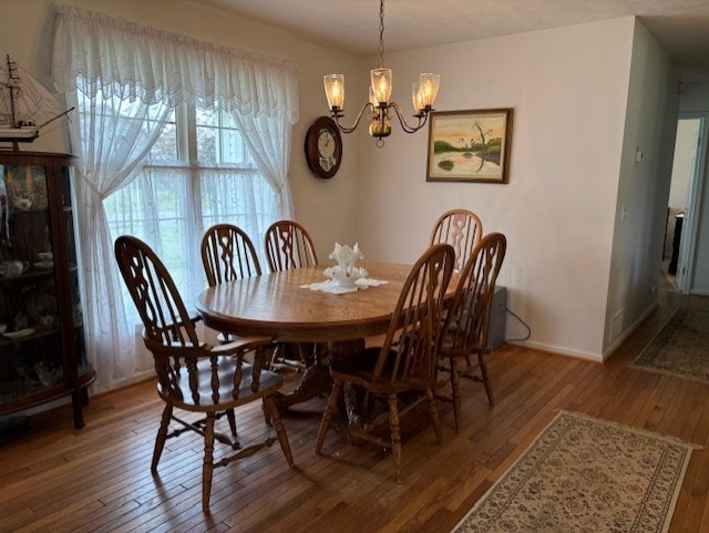 783 Whistlers Cove Ln, Greece, NY 14612 - dining space with hardwood / wood-style floors and a chandelier