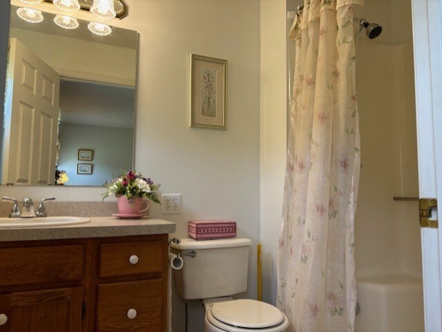 783 Whistlers Cove Ln, Greece, NY 14612 - bathroom with vanity and toilet