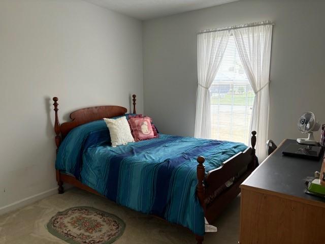783 Whistlers Cove Ln, Greece, NY 14612 - bedroom with carpet and baseboards
