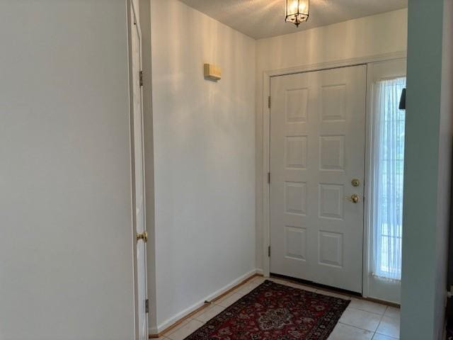 783 Whistlers Cove Ln, Greece, NY 14612 - foyer with light tile patterned floors and baseboards