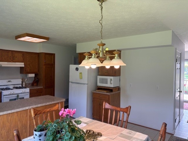 783 Whistlers Cove Ln, Greece, NY 14612 - tiled dining room featuring a chandelier and a textured ceiling
