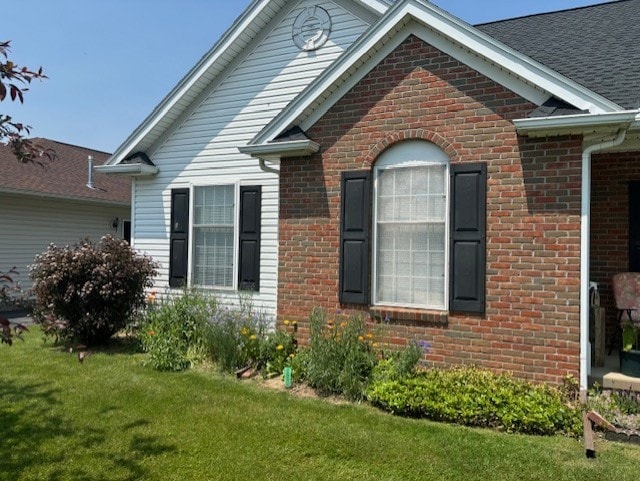 783 Whistlers Cove Ln, Greece, NY 14612 - view of property exterior with brick siding and a yard