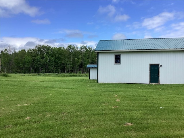 117 Wrench Ln, Coventry, NY 13733 - view of green lawn with an outdoor structure