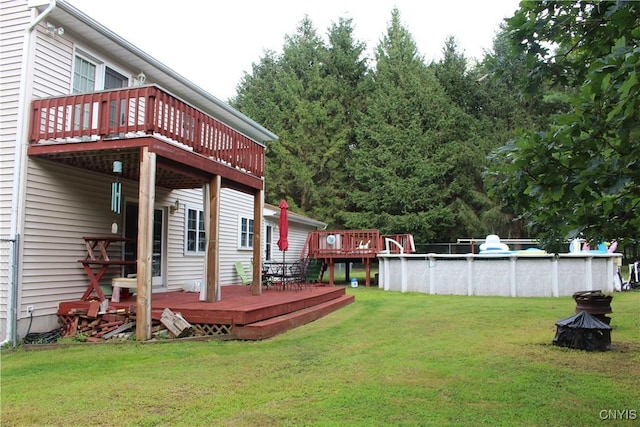 1808 Mulholland Rd, Vienna, NY 13123 - view of green lawn with a deck and an outdoor pool