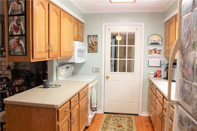 1808 Mulholland Rd, Vienna, NY 13123 - kitchen with white appliances, light countertops, light wood-style floors, and crown molding