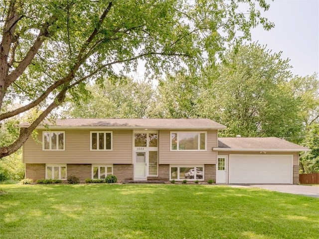 1333 Wayneport Rd, Macedon, NY 14502 - raised ranch with a garage, a front lawn, and concrete driveway