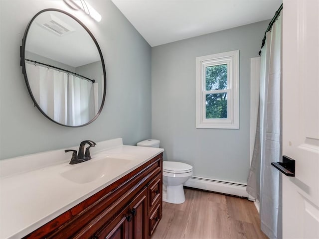 1333 Wayneport Rd, Macedon, NY 14502 - full bathroom featuring a baseboard heating unit, vanity, and wood finished floors