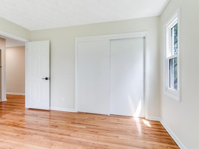 1333 Wayneport Rd, Macedon, NY 14502 - unfurnished bedroom with light wood-style flooring and a closet