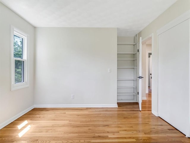 1333 Wayneport Rd, Macedon, NY 14502 - empty room featuring light wood-style flooring and built in shelves
