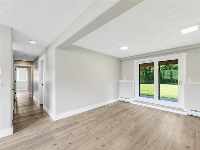 1333 Wayneport Rd, Macedon, NY 14502 - spare room with baseboard heating and light wood-type flooring
