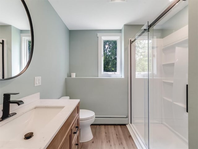 1333 Wayneport Rd, Macedon, NY 14502 - bathroom featuring a baseboard heating unit, vanity, a stall shower, and wood finished floors