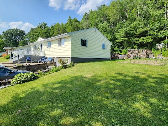 8637 State Route 415, Campbell, NY 14821 - view of green lawn featuring a wooden deck and stairs