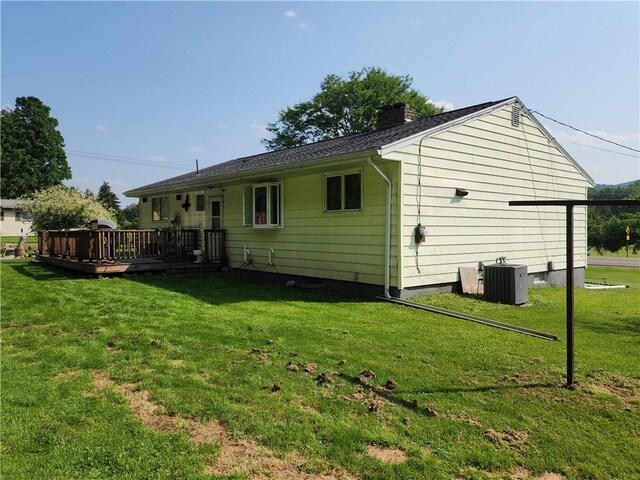 8637 State Route 415, Campbell, NY 14821 - back of house featuring a wooden deck, a chimney, and a lawn