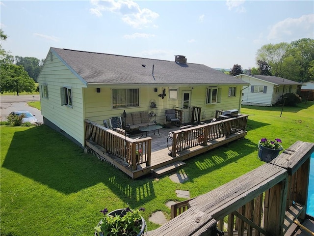 8637 State Route 415, Campbell, NY 14821 - back of house with an outdoor hangout area, a deck, a yard, a shingled roof, and a chimney
