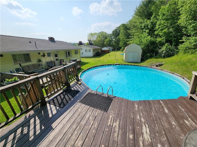 8637 State Route 415, Campbell, NY 14821 - outdoor pool with a shed, a wooden deck, and a lawn