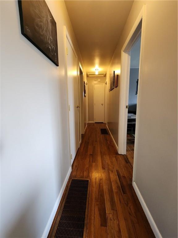 8637 State Route 415, Campbell, NY 14821 - corridor featuring dark wood finished floors and baseboards