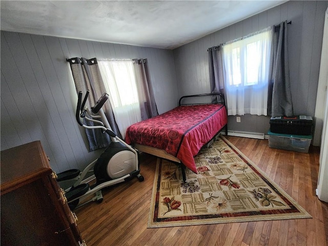 8637 State Route 415, Campbell, NY 14821 - bedroom featuring a baseboard radiator and hardwood / wood-style floors