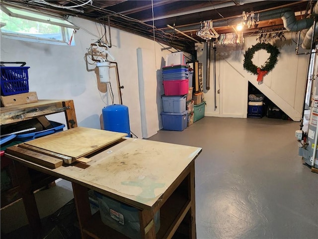 8637 State Route 415, Campbell, NY 14821 - basement featuring a water pressure tank and a workshop area