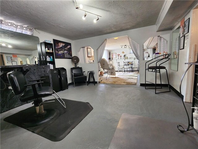 8637 State Route 415, Campbell, NY 14821 - miscellaneous room featuring a textured ceiling, finished concrete flooring, and arched walkways