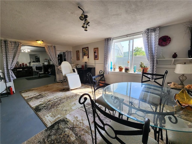 8637 State Route 415, Campbell, NY 14821 - dining room with concrete flooring, a textured ceiling, and a desk