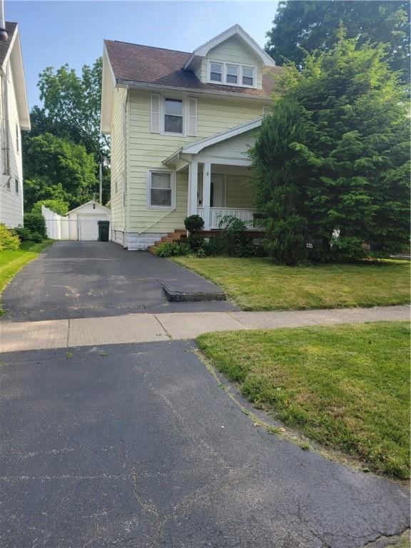 235 Congress Ave, Rochester, NY 14611 - american foursquare style home with a porch, a front lawn, an outdoor structure, asphalt driveway, and a garage