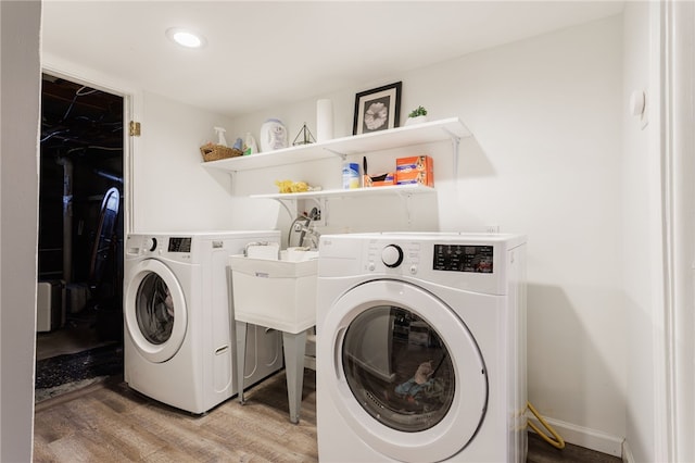 3389 Culver Rd, Irondequoit, NY 14622 - laundry room featuring washer and dryer, light wood-style flooring, and recessed lighting