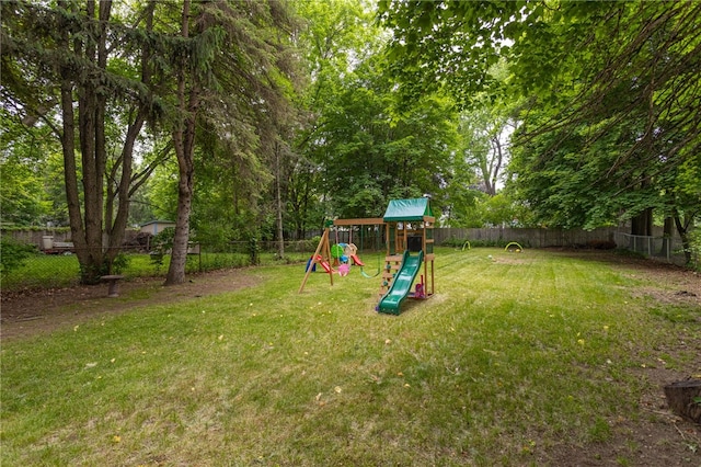 3389 Culver Rd, Irondequoit, NY 14622 - fenced backyard featuring a playground
