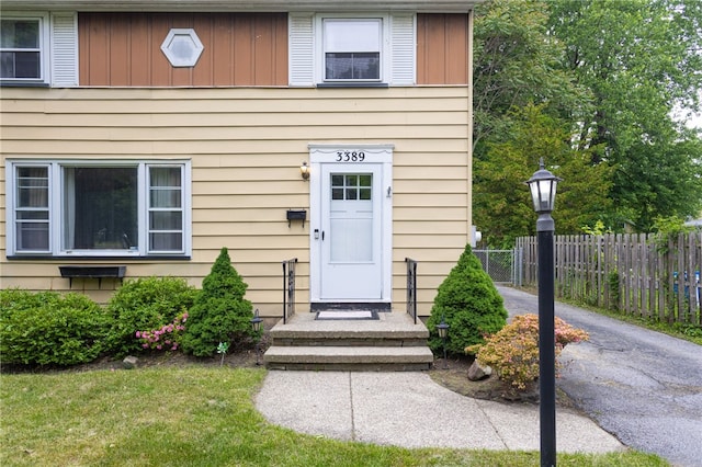 3389 Culver Rd, Irondequoit, NY 14622 - doorway to property featuring board and batten siding