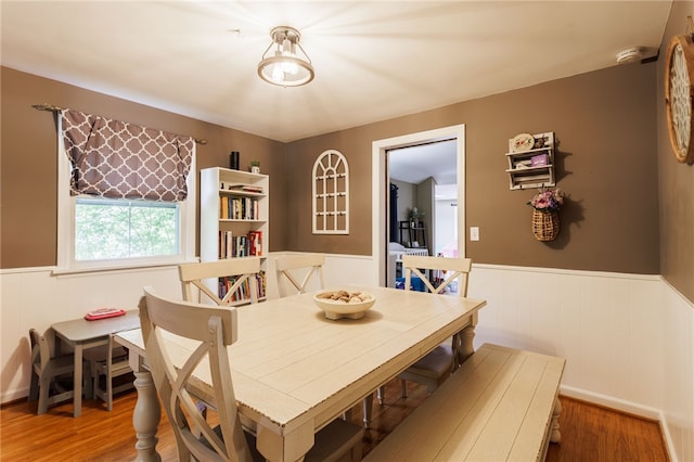 3389 Culver Rd, Irondequoit, NY 14622 - dining space featuring wainscoting and wood finished floors