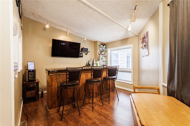 3389 Culver Rd, Irondequoit, NY 14622 - indoor dry bar with track lighting, dark wood-type flooring, and a textured ceiling