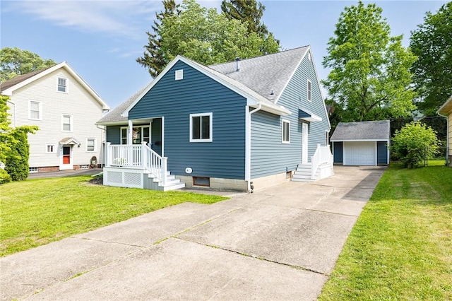 165 Culver Pkwy, Irondequoit, NY 14609 - bungalow-style home with an outbuilding, a front yard, roof with shingles, and a detached garage