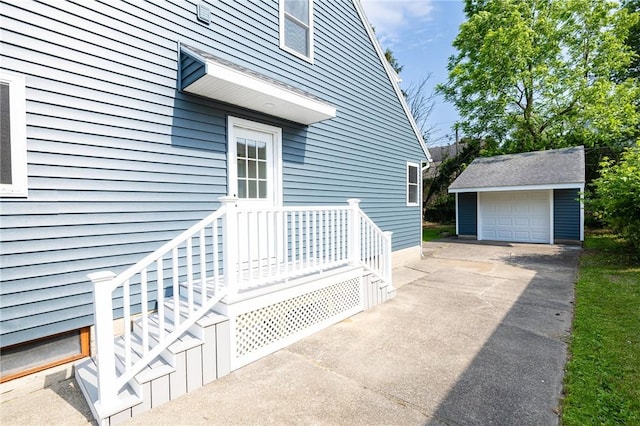 165 Culver Pkwy, Irondequoit, NY 14609 - property entrance with a detached garage