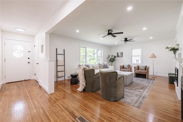 165 Culver Pkwy, Irondequoit, NY 14609 - living area with light wood-style flooring, a ceiling fan, a fireplace, and recessed lighting