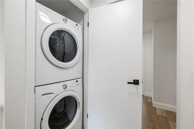 165 Culver Pkwy, Irondequoit, NY 14609 - laundry room with estacked washer and dryer and wood finished floors