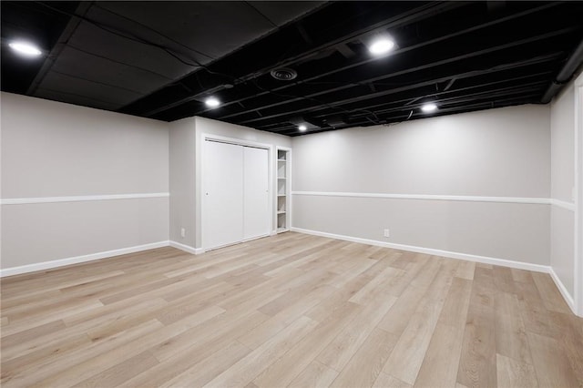 165 Culver Pkwy, Irondequoit, NY 14609 - finished basement with light wood-type flooring and baseboards