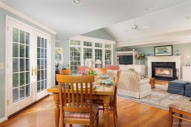 117 Halwill Dr, Amherst, NY 14226 - dining space with french doors, vaulted ceiling, wood finished floors, and healthy amount of natural light