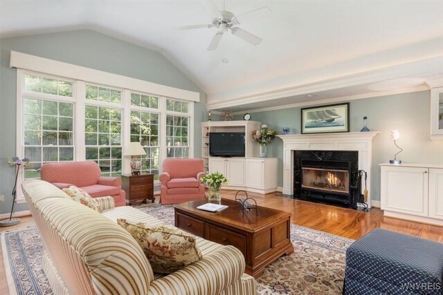 117 Halwill Dr, Amherst, NY 14226 - living room featuring vaulted ceiling, light wood-type flooring, a high end fireplace, and a ceiling fan