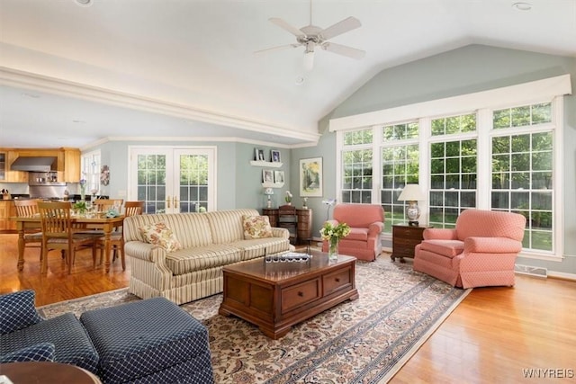 117 Halwill Dr, Amherst, NY 14226 - living area featuring wood finished floors, plenty of natural light, a ceiling fan, and vaulted ceiling