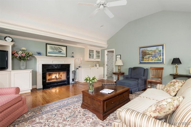 117 Halwill Dr, Amherst, NY 14226 - living room with a fireplace, wood finished floors, vaulted ceiling, and a ceiling fan