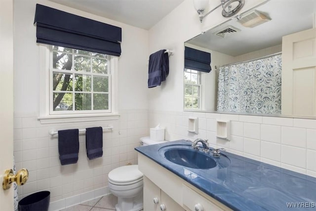 117 Halwill Dr, Amherst, NY 14226 - bathroom featuring tile walls, vanity, tile patterned floors, wainscoting, and a shower with curtain