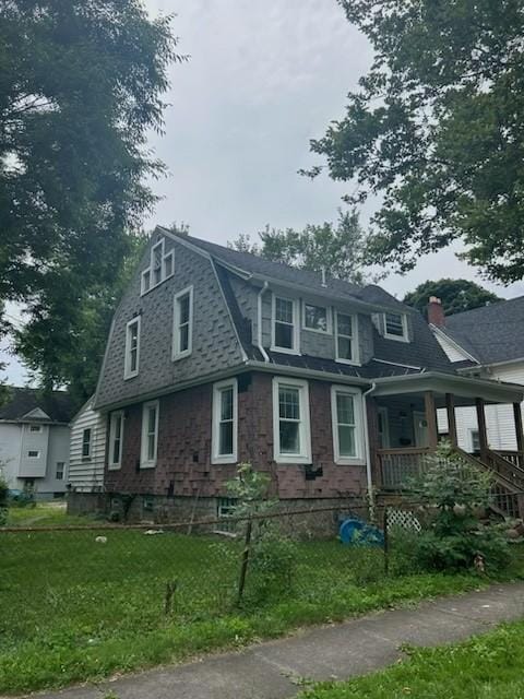 409 Glenwood Ave, Rochester, NY 14613 - colonial inspired home with covered porch, a gambrel roof, and a front yard