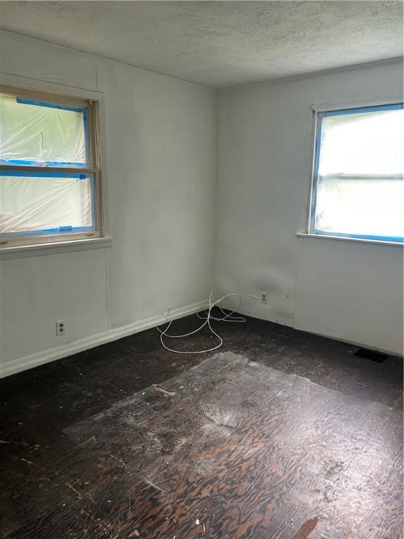 409 Glenwood Ave, Rochester, NY 14613 - unfurnished room featuring a textured ceiling