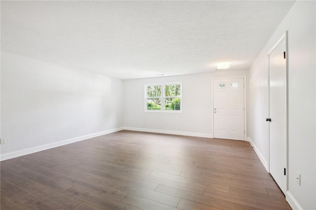 1A Salmon Run, Parma, NY 14468 - entrance foyer featuring dark wood finished floors and a textured ceiling