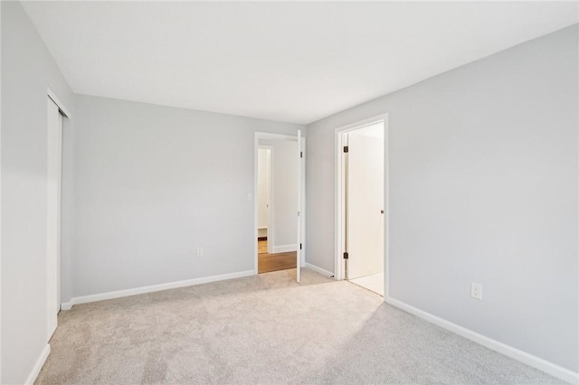 1A Salmon Run, Parma, NY 14468 - unfurnished bedroom featuring light carpet and a closet